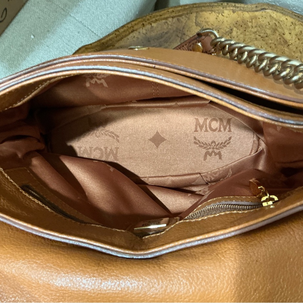 MCM shoulder bag in a tan or cognac featuring gathered flap and whipstitch trim - Picture 6 of 9